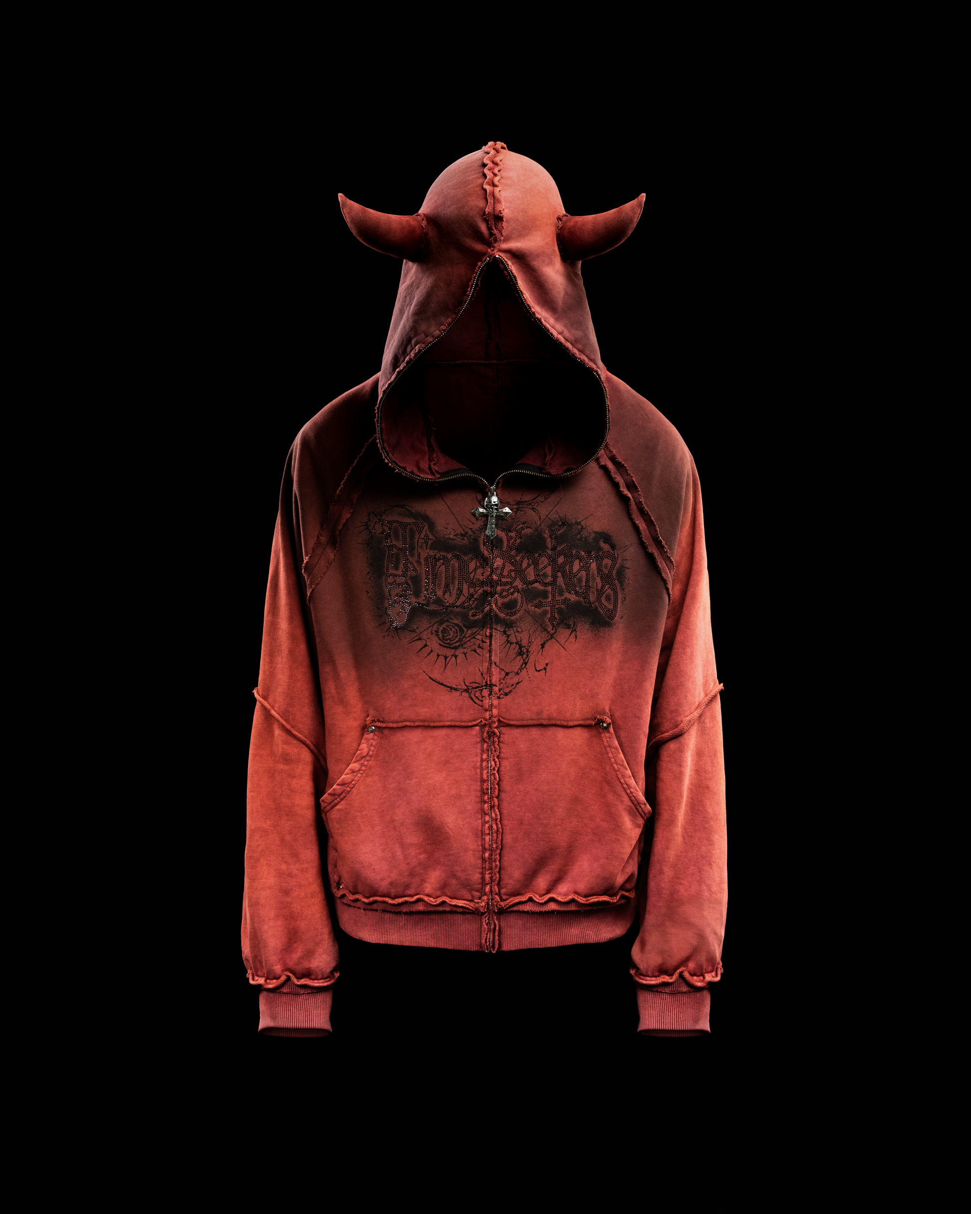 A maroon-colored hoodie with a full zip closure, aged silver rivets, and black Timeseekers rhinestone artwork on the front. It features a hood with devilish horns and a custom skull-cross zip-puller.